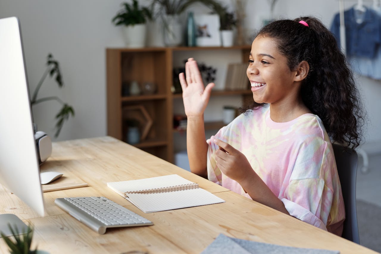 A young girl having an online lesson.
